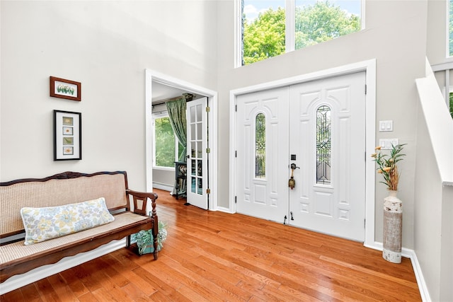 4 S Hill Rd, Tomkins Cove, NY 10986 - foyer entrance featuring light wood-style floors, baseboard heating, and a towering ceiling
