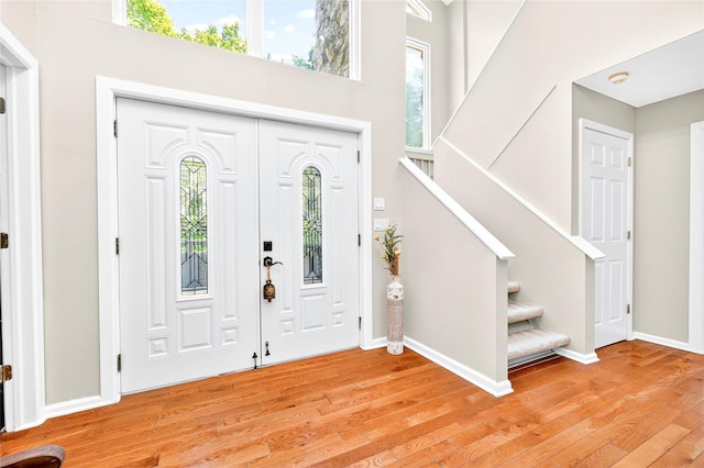 4 S Hill Rd, Tomkins Cove, NY 10986 - entryway featuring light wood finished floors, stairway, and a towering ceiling