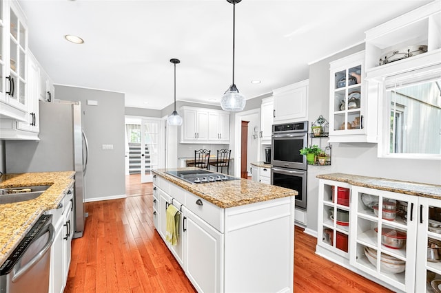 4 S Hill Rd, Tomkins Cove, NY 10986 - kitchen featuring stainless steel appliances, a center island, white cabinets, recessed lighting, and light wood-type flooring