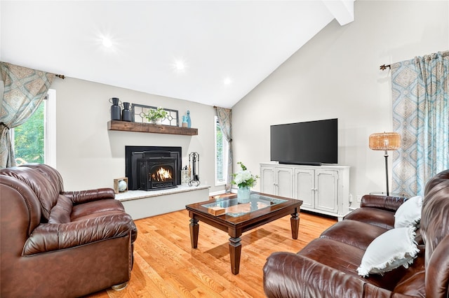4 S Hill Rd, Tomkins Cove, NY 10986 - living area featuring high vaulted ceiling, light wood-style floors, a warm lit fireplace, beam ceiling, and recessed lighting