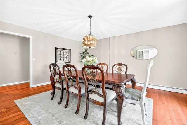 4 S Hill Rd, Tomkins Cove, NY 10986 - dining area featuring a chandelier, wood finished floors, and a baseboard radiator
