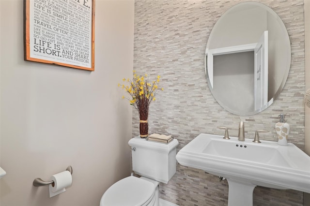 8 Langeloth Dr, Cortlandt Manor, NY 10567 - half bath featuring tile walls and backsplash