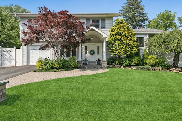 7 Nantucket Ln, Deer Park, NY 11729 - obstructed view of property featuring a garage and asphalt driveway