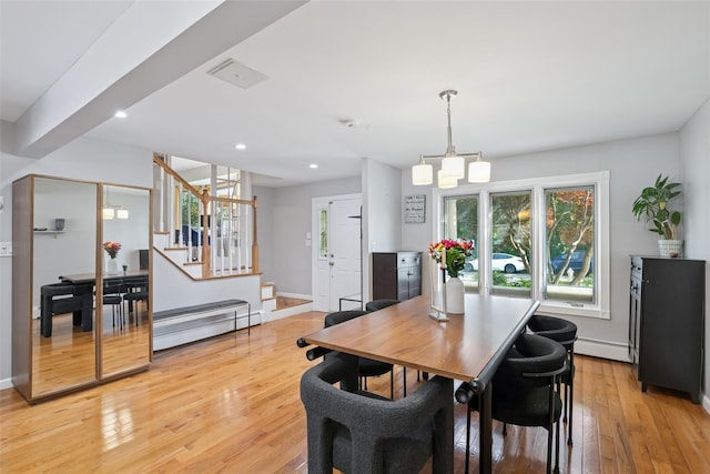 7 Nantucket Ln, Deer Park, NY 11729 - dining area featuring a baseboard radiator, baseboard heating, light wood finished floors, recessed lighting, and stairway