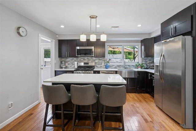 7 Nantucket Ln, Deer Park, NY 11729 - kitchen with stainless steel appliances, light countertops, light wood-style flooring, and recessed lighting
