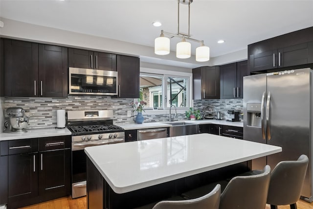 7 Nantucket Ln, Deer Park, NY 11729 - kitchen with appliances with stainless steel finishes, a kitchen bar, light countertops, recessed lighting, and decorative backsplash