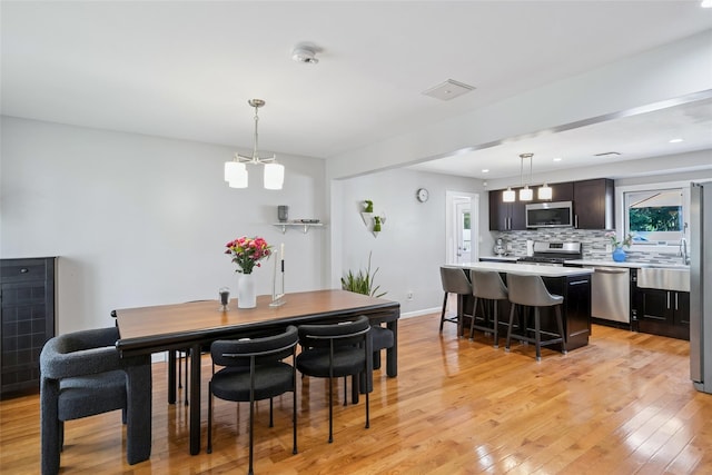 7 Nantucket Ln, Deer Park, NY 11729 - dining space featuring light wood-style flooring and recessed lighting