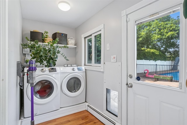 7 Nantucket Ln, Deer Park, NY 11729 - laundry room featuring washing machine and clothes dryer, plenty of natural light, and wood finished floors