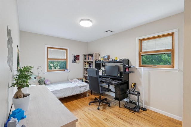 7 Nantucket Ln, Deer Park, NY 11729 - bedroom with wood finished floors and a desk