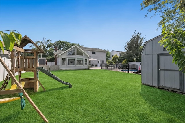 7 Nantucket Ln, Deer Park, NY 11729 - fenced backyard featuring a playground and a storage shed