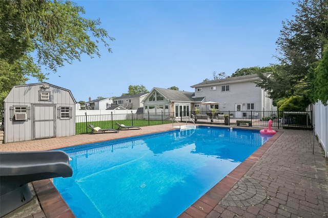 7 Nantucket Ln, Deer Park, NY 11729 - view of pool with a water slide, a storage shed, and cooling unit