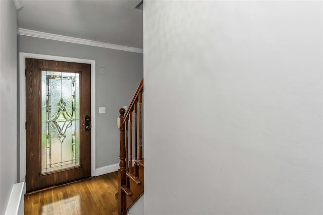 20 Spring Garden St, Valley Stream, NY 11580 - foyer entrance with wood finished floors, stairs, and crown molding