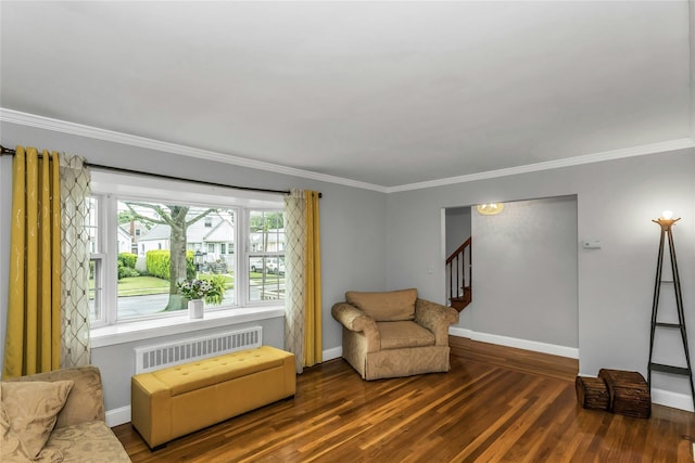 20 Spring Garden St, Valley Stream, NY 11580 - living area featuring radiator, crown molding, wood finished floors, and stairway