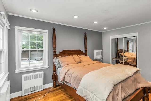 20 Spring Garden St, Valley Stream, NY 11580 - bedroom with radiator, wood finished floors, ornamental molding, a closet, and recessed lighting