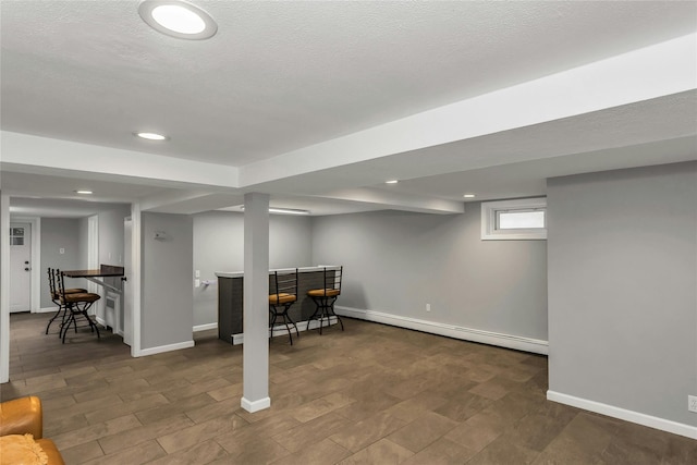 20 Spring Garden St, Valley Stream, NY 11580 - below grade area featuring a dry bar, baseboard heating, and recessed lighting
