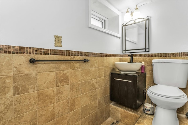 20 Spring Garden St, Valley Stream, NY 11580 - bathroom featuring vanity, wainscoting, and tile walls
