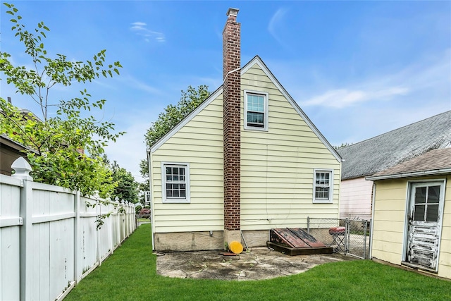 20 Spring Garden St, Valley Stream, NY 11580 - rear view of house featuring a chimney