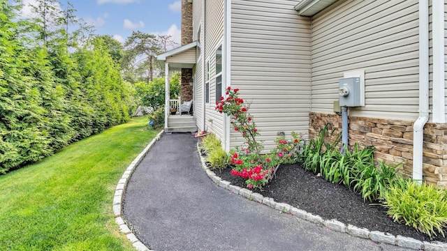 35 Terrace Ln Unit 35, Patchogue, NY 11772 - entrance to property featuring a yard
