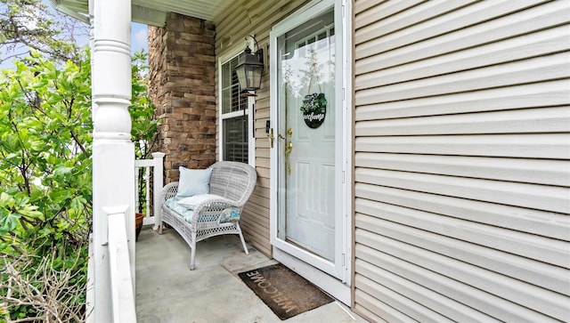 35 Terrace Ln Unit 35, Patchogue, NY 11772 - doorway to property featuring a porch