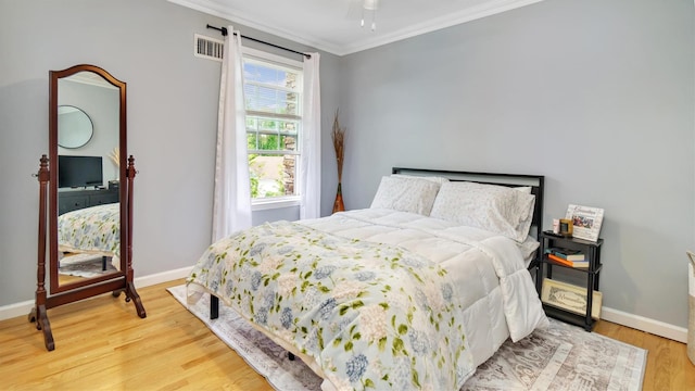 35 Terrace Ln Unit 35, Patchogue, NY 11772 - bedroom with ornamental molding and wood finished floors