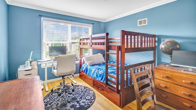 35 Terrace Ln Unit 35, Patchogue, NY 11772 - bedroom with ornamental molding, wood finished floors, and an office area