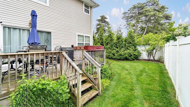 35 Terrace Ln Unit 35, Patchogue, NY 11772 - fenced backyard featuring a wooden deck
