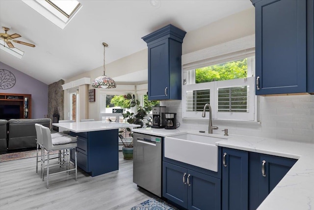 1 Ledgewood Cir E, Setauket, NY 11733 - kitchen featuring stainless steel dishwasher, blue cabinets, a skylight, a sink, and lofted ceiling