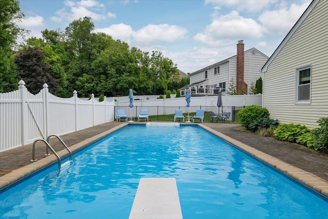 1 Ledgewood Cir E, Setauket, NY 11733 - view of swimming pool featuring a fenced backyard and a diving board