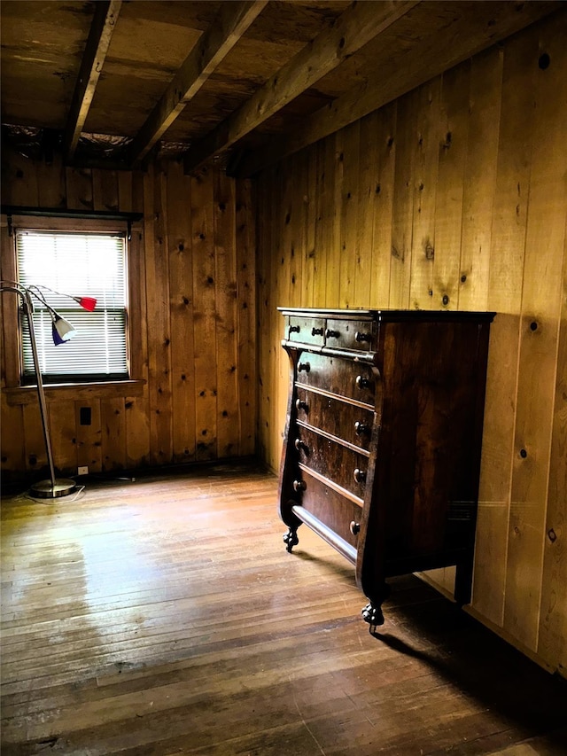 26 E Tusten, Smallwood, NY 12778 - empty room featuring wood-type flooring, beam ceiling, and wooden walls