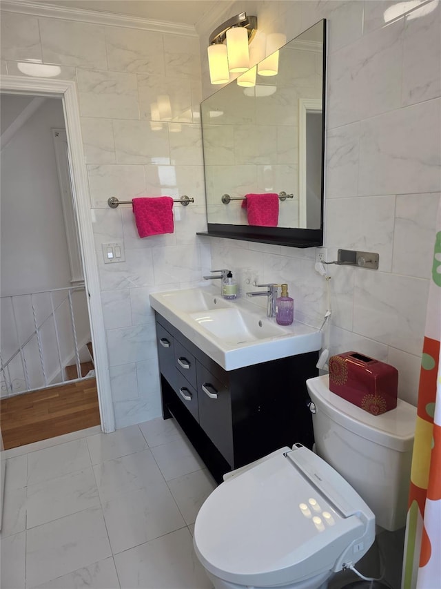 244-59 89th Ave, Bellerose, NY 11426 - bathroom with tile walls, vanity, crown molding, and marble look tile flooring