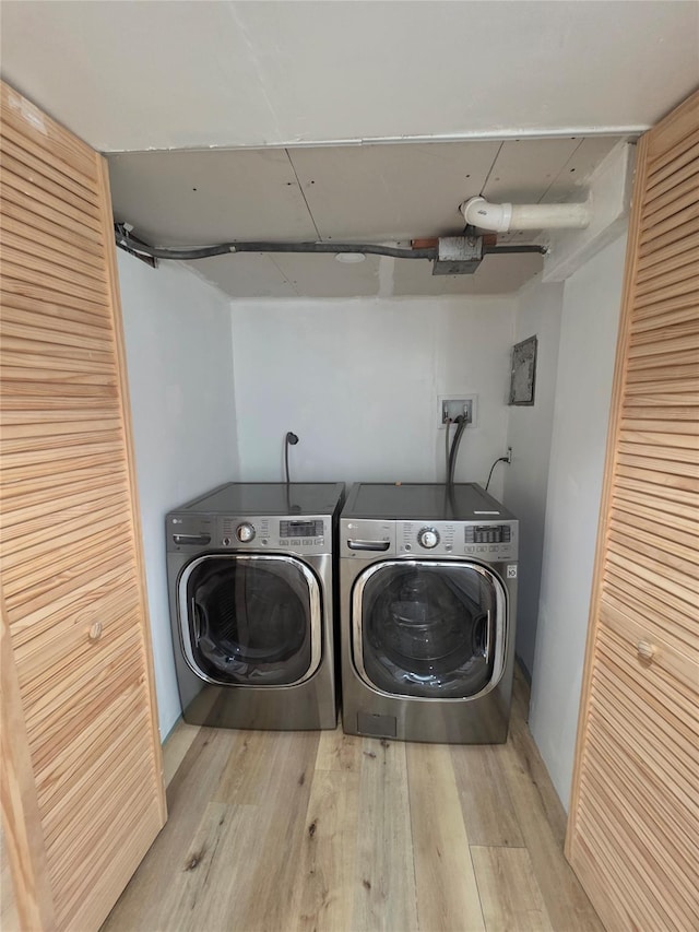 244-59 89th Ave, Bellerose, NY 11426 - laundry room with washing machine and dryer and wood finished floors
