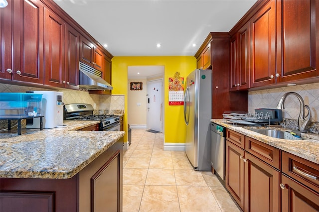41 Wellington Ct Unit 1L, Staten Island, NY 10314 - kitchen with under cabinet range hood, appliances with stainless steel finishes, a sink, dark brown cabinets, and backsplash
