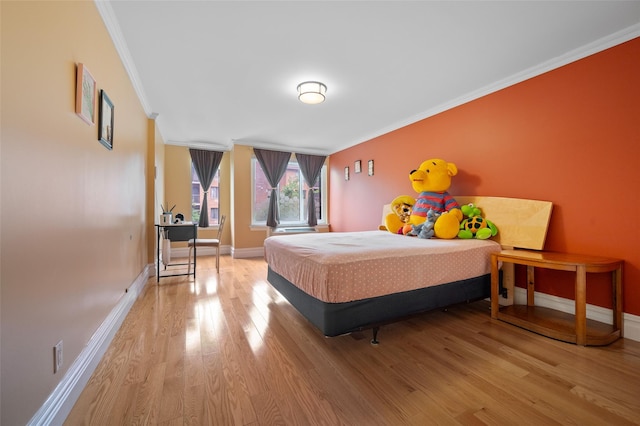 41 Wellington Ct Unit 1L, Staten Island, NY 10314 - bedroom with crown molding, wood finished floors, and baseboards