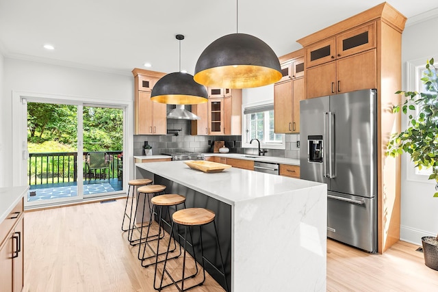 2022 Van Cortlandt Cir, Yorktown Heights, NY 10598 - kitchen with appliances with stainless steel finishes, light wood finished floors, backsplash, light countertops, and crown molding