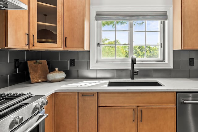 2022 Van Cortlandt Cir, Yorktown Heights, NY 10598 - kitchen with under cabinet range hood, appliances with stainless steel finishes, glass insert cabinets, and decorative backsplash