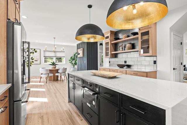 2022 Van Cortlandt Cir, Yorktown Heights, NY 10598 - kitchen featuring stainless steel fridge with ice dispenser, light wood-style flooring, backsplash, dark cabinets, and open shelves