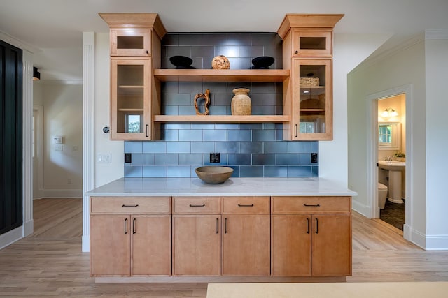 2022 Van Cortlandt Cir, Yorktown Heights, NY 10598 - kitchen with light wood-type flooring, decorative backsplash, open shelves, ornamental molding, and glass insert cabinets