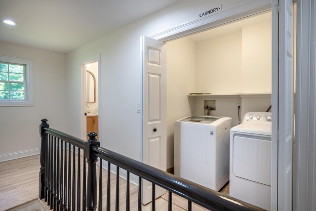 2022 Van Cortlandt Cir, Yorktown Heights, NY 10598 - laundry room with washing machine and clothes dryer, light wood finished floors, and recessed lighting