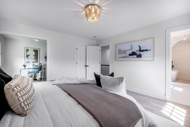 2022 Van Cortlandt Cir, Yorktown Heights, NY 10598 - bedroom with wood finished floors and connected bathroom
