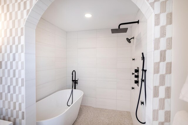 2022 Van Cortlandt Cir, Yorktown Heights, NY 10598 - bathroom featuring a soaking tub, a tile shower, tile walls, and recessed lighting