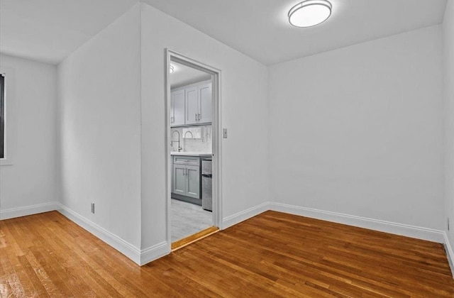 67-47 136th St Unit A, Kew Garden Hills, NY 11367 - empty room with light wood finished floors and baseboards