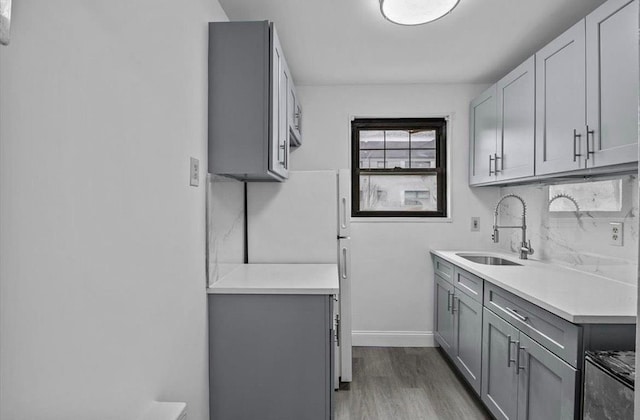67-47 136th St Unit A, Kew Garden Hills, NY 11367 - washroom featuring a sink and wood finished floors