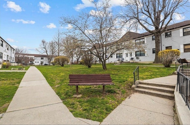 67-47 136th St Unit A, Kew Garden Hills, NY 11367 - surrounding community with a residential view and a yard