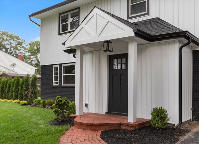 105 Julbet Dr, Sayville, NY 11782 - entrance to property with roof with shingles and a lawn