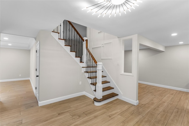 105 Julbet Dr, Sayville, NY 11782 - stairs featuring wood finished floors, recessed lighting, and a chandelier