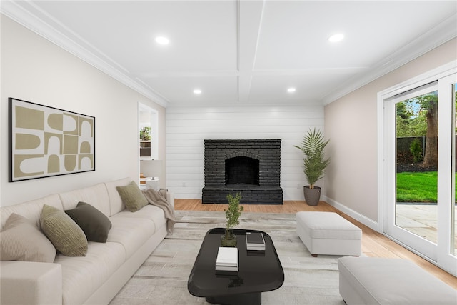 105 Julbet Dr, Sayville, NY 11782 - living room with healthy amount of natural light, recessed lighting, light wood-style floors, crown molding, and a fireplace