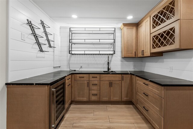 105 Julbet Dr, Sayville, NY 11782 - kitchen with beverage cooler, light wood-style floors, recessed lighting, and decorative backsplash