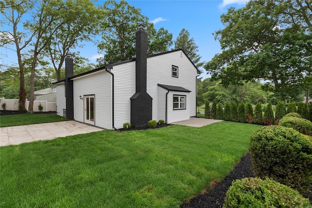105 Julbet Dr, Sayville, NY 11782 - view of side of property featuring a chimney and a patio