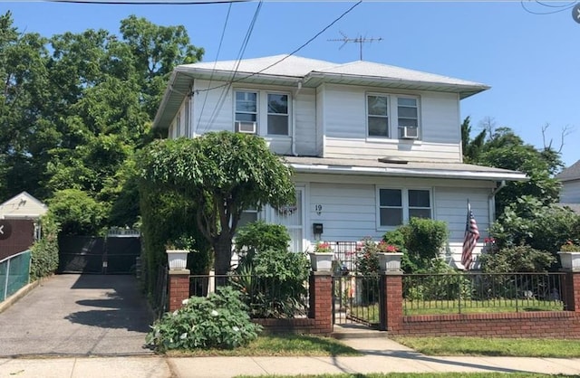 19 Bainton St, Yonkers, NY 10704 - view of front of property featuring a fenced front yard, a gate, and driveway