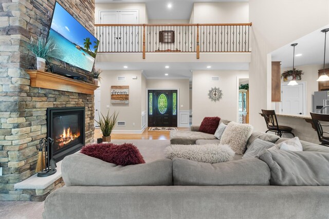 1 Hidden Hills Ct, Warwick, NY 10990 - living room with a towering ceiling, a fireplace, wood finished floors, and recessed lighting